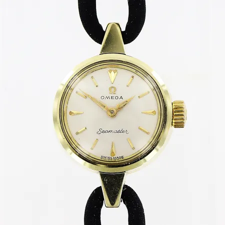 Damur Omega, guld på stål, manuell, Ø20mm, fungerar vid testtillfälle, textilband omärkt, 19cm, inga tillbehör. 