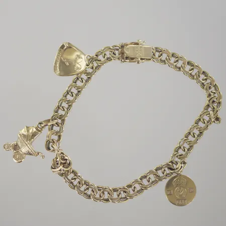 Armband bismark med berlocker, längd 19 cm, bredd 5,6 mm, 18K Vikt: 16,6 g