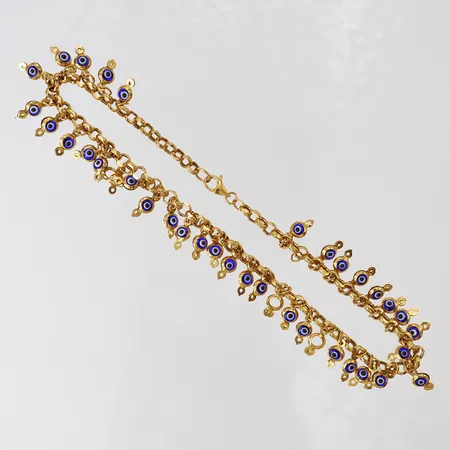 Vristlänk, längd 28cm, bredd 14mm, 18K.  Vikt: 14,6 g