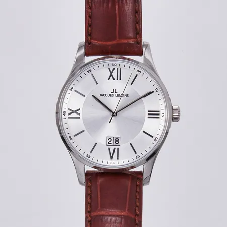 Herrur Jacques lLemans, quartz, modellnr 1-1845, stål, repa på baksida, med läderband, ej använd, behov av batteribyte, inga tillbehör 