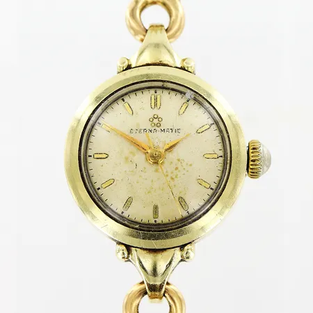 Damur Eterna-Matic, Ø20mm, manuell, guld på stål, länk i X-länksmodell 18,3cm i 18K, fläckig urtavla, slitage på länk, bruttovikt: 24,0gram. Vikt: 24 g