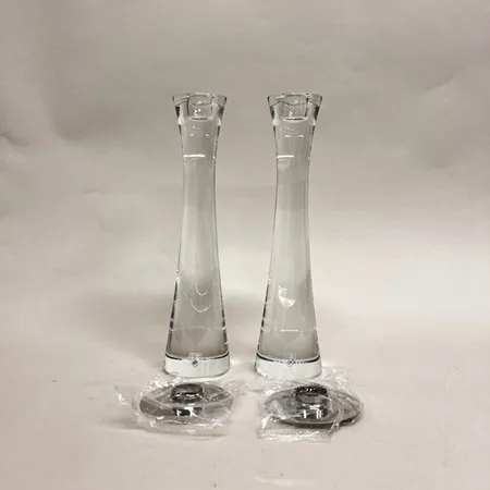 Ett par ljusstakar, Houston, Orrefors, design Ingegerd Råman, höjd ca 28cm, stämpel- etikett märkt, manual, original kartong Vikt: 0 g Skickas med postpaket.