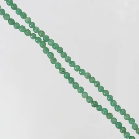 Collier med gröna stenar, längd ca 87cm, Ø4mm, bruksslitage. 