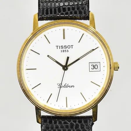 Herrur Tissot Goldrun, boett Ø34 mm, quartz, datum, läderband, behov av batteribyte, graverad bakboett, bruttovikt 29,7g, 18K.
