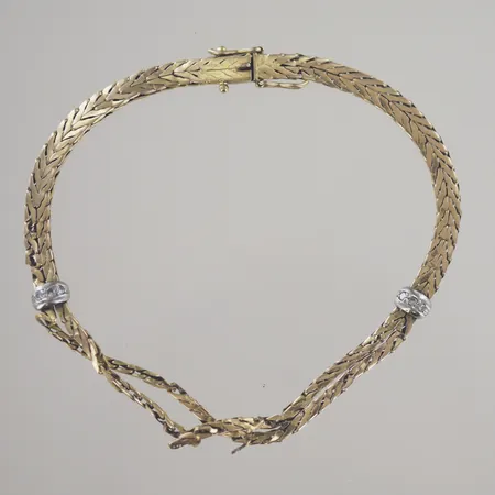 Armband med diamanter 6 x 0,01ct, längd 20,5 cm, bredd 4-8 mm, defekta vassa länkar, 18K  Vikt: 11 g