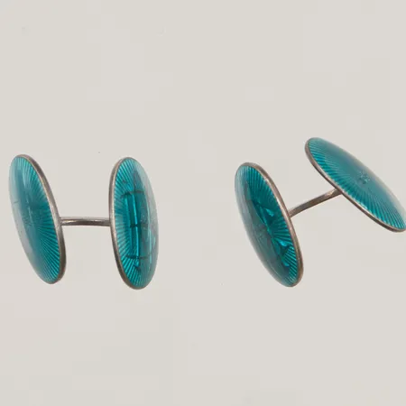 Ett par manschettknappar, 20mm, graverade, defekt glasyr, 830/1000 Silver 8,5g.