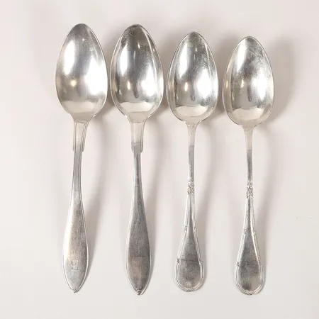 Fyra matskedar, bland annat K Anderson, Stockholm, längd 21-22,5cm, gravyr, slitage, silver. Vikt: 258 g