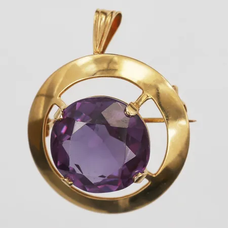 Brosch/hänge med ametist, Ø28mm, tillverkad år 1964 av Nyströms G-Verkstad Sven-Uno Nyst, ögla något skev, 18K, bruttovikt 12,2g Vikt: 12,2 g