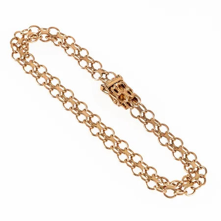 Armband, X-länk i 18K guld. Det är 20 cm långt, 7 mm brett och väger 9,5g. Kistlås. Stämplad 18K & kattfot.