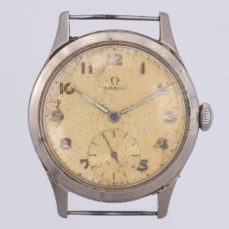 Herrur Omega, manuell, caliber 265, verk nr 12081563, Ø35mm, repigt glas, missfärgad urtavla, saknar band, stål