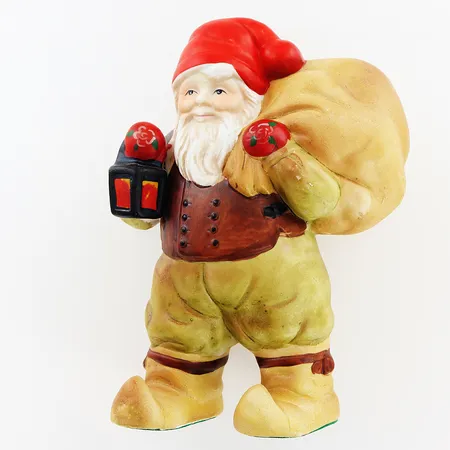 Tomtefigurin Caroline Grinda Christensson, tomte med säck, 17cm, kartong Vikt: 0 g Skickas med paket.