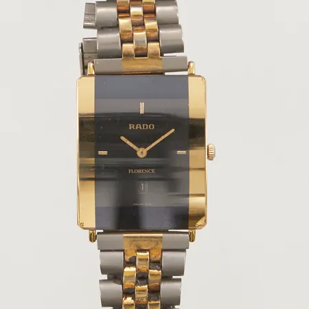 Armbandsur Rado Florence, 26x32mm, quartz, doublé, refnr:160.3670.2, serienr:010630619, länk i titan/doublé, går ej, batteribyte, naggat glas, sliten.