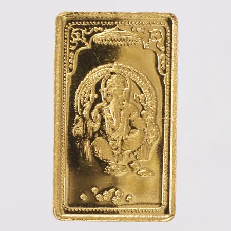 Guldtacka med dekor av Ganesha, tbz, längd 31mm, bredd 18mm, 24K Vikt: 20 g