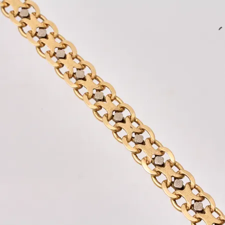 Collier i 18K guld, 41cm, X-länk med vitgulds detalj, bredd 8,8mm, personlig gravyr på undersida lås, tillverkad av Ge-Kå Rolf Kaplan Ab, år1979, vikt 51,61g.
