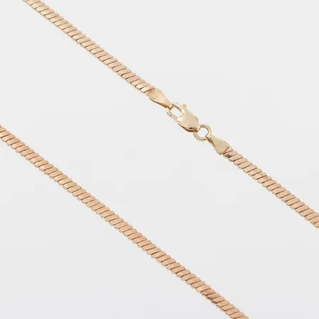 Collier, större ojämnheter, längd ca 43 cm, bredd 2.5 mm, 18k. Vikt: 6,9 g