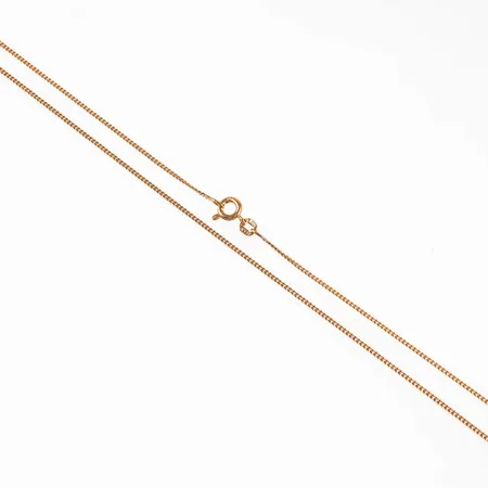 Kedja, Pansar i 18K guld. Det är 40 cm långt, 1,3 mm brett och väger 3,0g. Springring. 