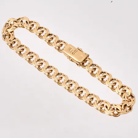 Armband i 18K guld, 19,5cm, Bismarck, bredd 7,4mm, tillverkad av H Johnson Aktiebolag, år 1959, vikt 21,28g.