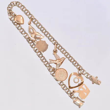 Armband Bismarck med berlocker, längd 19 cm, bredd länk 4 mm, 18K. Vikt: 9,2 g