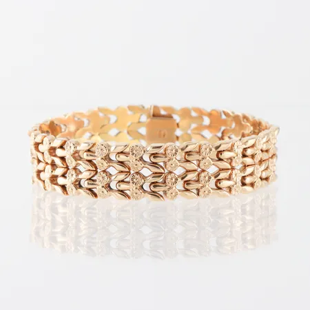 Armband Italien,defekt,knappen till låsåttan saknas,längd ca 20 cm, bredd 15.8 mm,18k. Vikt: 27,7 g