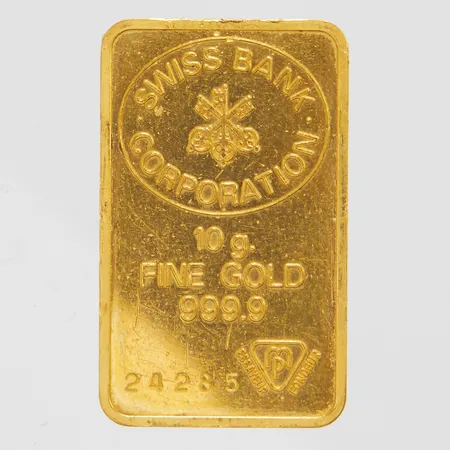 Guldtacka Swiss Bank Coroporation, Fine gold 999,9, serienr 24285, ca 25 x 15mm, borrhåll, repig, 24K Vikt: 10 g