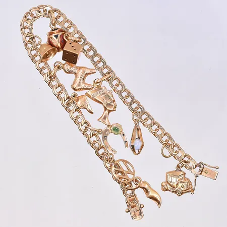 Armband Bismarck med berlocker, längd 19 cm, bredd länk 5 mm, 18K. Vikt: 17,1 g