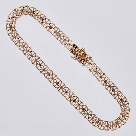 Armband x-länk, längd: ca 20,5cm, bredd: ca 5mm, N S E Guldvaru Aktiebolag, år 1997, 18K Vikt: 6,9 g