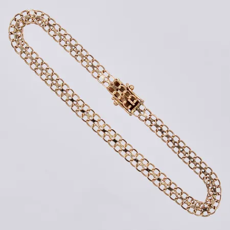 Armband N S E Guldvaru Aktiebolag X-länk 1991, längd ca 18,5cm bredd ca 5mm, 18K Vikt: 5,6 g