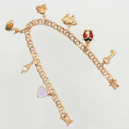 Armband Bismarck med sju berlocker, längd 18,5cm, bredd 5,2mm, skadad emalj, 18K  Vikt: 15,4 g