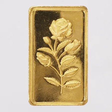 Guldtacka med dekor av blomma, Pure gold, längd 30,6mm, bredd 18mm, 24K Vikt: 20 g