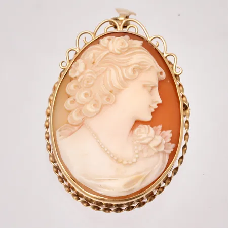 Hänge/Brosch i 18K guld, mått 33x55,5mm, bruttovikt 12,43g, ca nettovikt 5,2g.