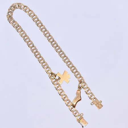 Armband Bismarck med 2 berlocker, längd 19 cm, bredd länk 4 mm, 18K. Vikt: 6,2 g