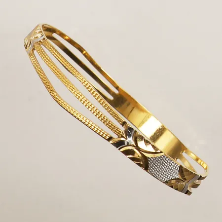 Armring, innermått ca 20cm, Ø65mm, bredd 87mm, tvåfärgad,skev, 22K Vikt: 18,7 g