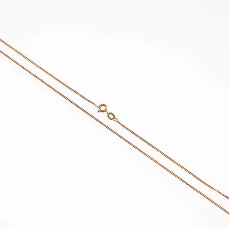 Kedja, pansar, i 14K guld. Den är 42,5 cm lång, 1,25 mm bred och väger 2,2g. Springring. Stämplad 585.