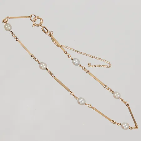 Armband, 6st odlade pärlor Ø ca 4mm, stavar ca 1mm, längd ca 19cm, säkerhetskedja av, 18K Vikt: 2,8 g