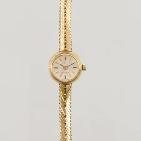 Damur Omega 18K, 14,5mm, manuell, cal. 650, boettnr: 619310 7154, verknr: 21092070, ca 1964, servicebehov, integrerad länk i 18K, längd inklusive uret: 17cm, bruttovikt: 23,7g.