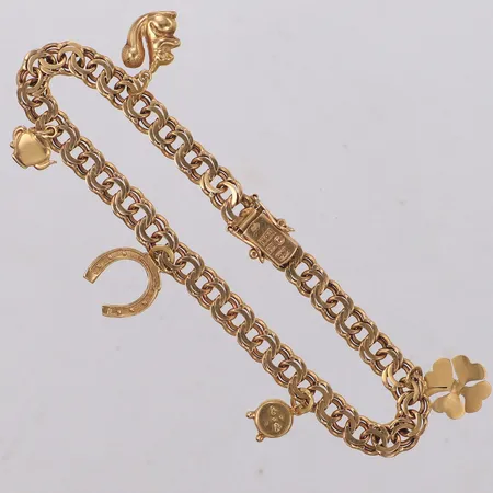 Armband Bismarck, fem berlocker, längd 19cm, bredd 6mm, 18K Vikt: 14,1 g