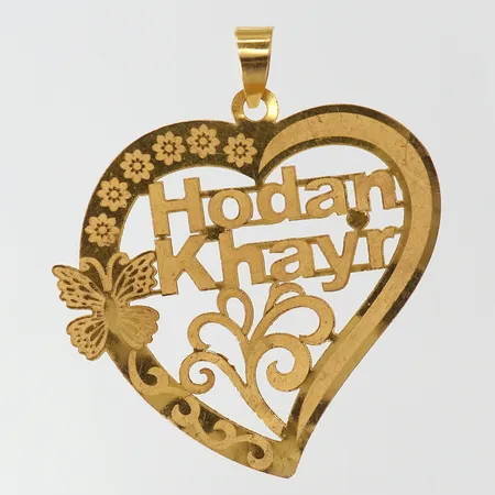 Hänge med dekor, 49x45mm ink ögla, gravyr, 21K.  Vikt: 5,6 g