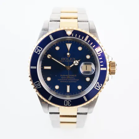 Herrur  Rolex Guld/stål Submariner. blå urtavla, ref: 16613 Serie nr: A227418. Box & cert, uttagen 1999 Helsingborg Vikt: 0 g