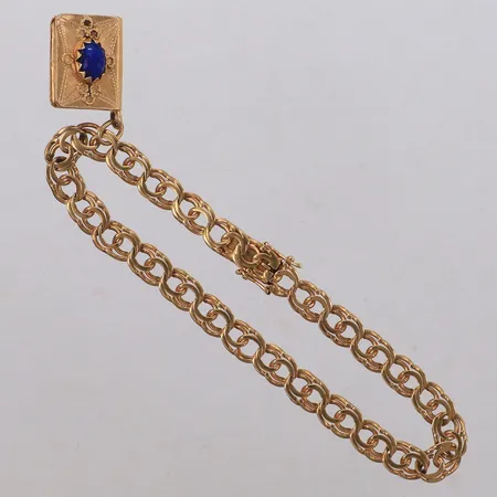 Armband Bismarck, 21cm, bredd 6,5mm, med hänge/ bok ostämplad 18K, med blå stenar, naggade, bucklor, 18K Vikt: 17,8 g