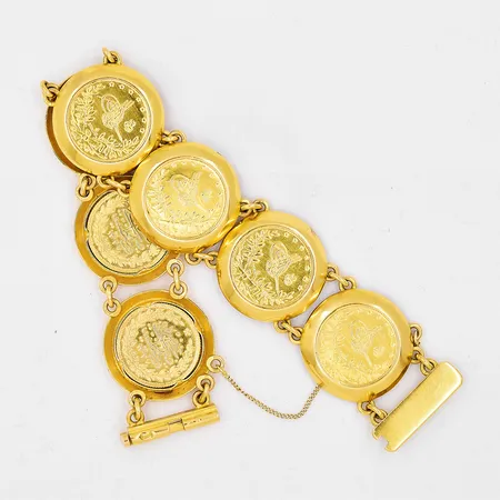 Armband myntliknande, ca 18cm, bredd 23,5mm, säkerhetskedja, ostämplad, 18/21K Vikt: 51,8 g