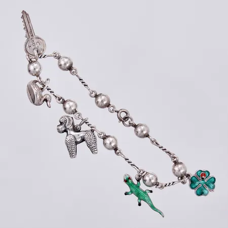 Armband med 5 berlocker, längd: ca 18cm, bredd: ca 1-5mm, 830/1000, silver Vikt: 11,4 g