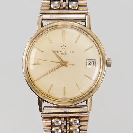 Herrur Eterna-Matic 3000, guld på stål, automat, ca 34mm, boettnr: 346 T, serienummer: 4667664, cal 1466T, repigt plexiglas, länk ej original