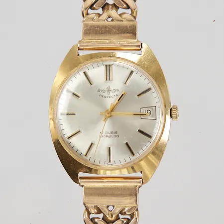Herrur Perfecta 18K, manuellt, Ø ca 35mm, datum, integrerat länk 18K, totalt längd inkl ur ca 21cm, bredd ca 16mm, 18K bruttovikt 100,1g