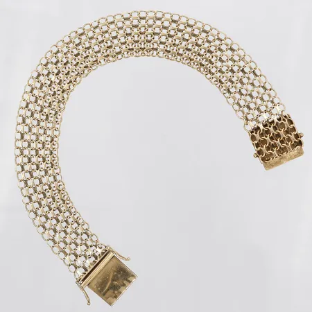 Armband, X-länk, 21cm, 16mm, något buckliga länkar vid änderna av bandet, tillverkad år 1971 av Stockholms Stads Arbetsvårdsbyrå,18K Vikt: 20,2 g