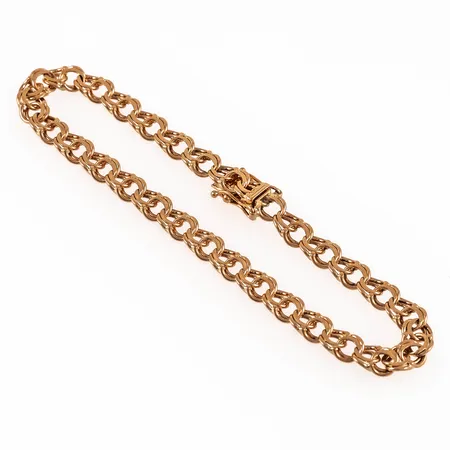 Armband, bismarck, i 18K guld. Det är 21 cm långt, 5,9 mm brett och väger 12,6g. Kistlås. Nött i länkarna närmast låset.