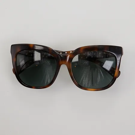 Ett par solglasögon Ralph Lauren, modell RA5213, nummer 316071, 55¤17, 140 3N, använt skick, original etui.