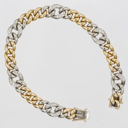 Armband med briljantslipade diamanter 24x ca 0,02ct, längd 17½cm, bredd 8mm, tillverkat av Jan Hellströmer, Stockholm, år 1989, 18K guld samt vitguld Vikt: 36,6 g