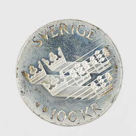 Minnesmynt Europeiska musikåret 1985, nominellt värde 100kr, Ø32mm, 925/1000 silver Vikt: 16,2 g