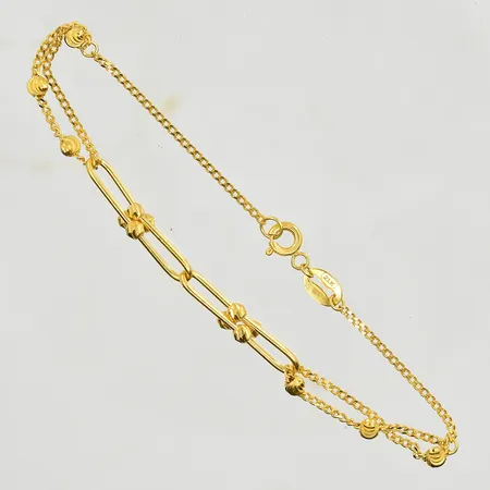 Armband med kedjelänkar, längd 17½ cm, bredd 1-4 mm, 21K. Vikt: 3,5 g