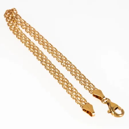 Armband i 18K guld. Det är 19 cm långt, 5 mm brett och väger 5,0g. Karbinhake. 